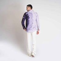 Back view of the purple ombre tie-dye shirt with white trousers