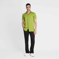 Angled front view of the solid neon green camp shirt, close-up with black trousers