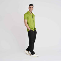 Angled front view of the solid neon green camp shirt with black trousers