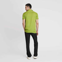 Back view of the solid neon green camp shirt with black trousers