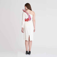 Back view of the white one-shoulder dress showing the back slit