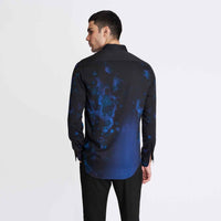 Back view of the black and blue tie-dye print shirt with black trousers