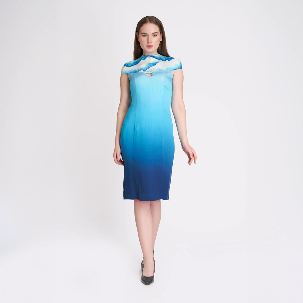 Front view of the ombre blue midi dress with a cloud print yoke and shoulder cutout