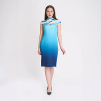 Front view of the ombre blue midi dress with a cloud print yoke and shoulder cutout