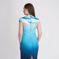 Close-up back view of the ombre blue dress showing the cloud print yoke and cutout detail