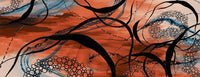 Flat detail of the orange and blue abstract line print on the scarf fabric
