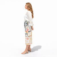 Side profile view of the multicolor drip print midi skirt with a white blouse