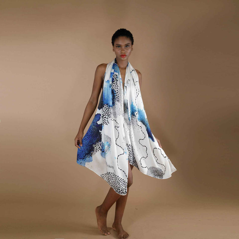 Front view of the blue watercolor and polka-dot print scarf draped as a halter dress