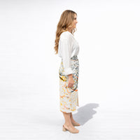 Side view of the abstract drip print midi skirt with front slit and knotted waist detail