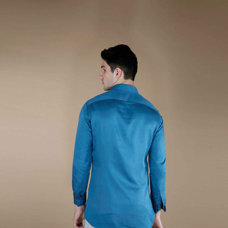 Back view of the solid teal blue silk shirt