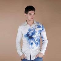 Front view of the cream shirt with a blue watercolor ink-wash print
