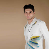 Close-up front view of the white shirt showing the bird and watercolor print detail