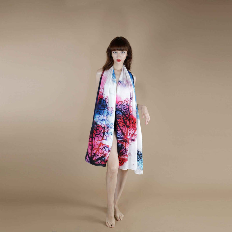 Front view of the pink and navy watercolor branch print scarf worn as a halter wrap dress