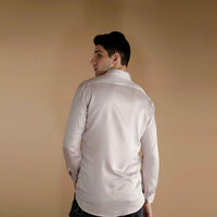 Back view of the white shirt with a hand-painted bird and watercolor branch print