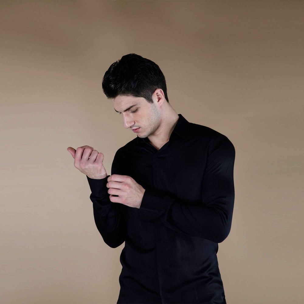 Front view of the solid black silk shirt with cuff detail