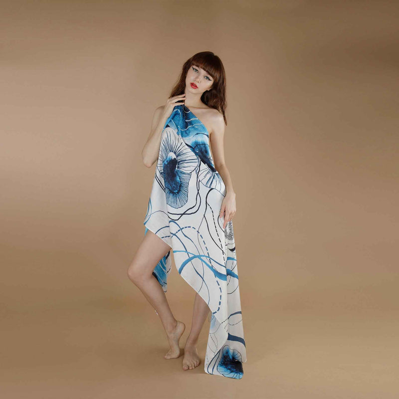 Front view of the blue floral line-art print scarf worn as an asymmetric wrap dress