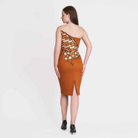 Back view of the rust orange strapless dress showing the back slit