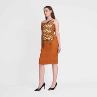 Side view of the rust orange strapless dress showing the butterfly wing print