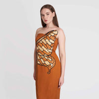 Close-up front view of the rust orange strapless dress highlighting the butterfly wing print