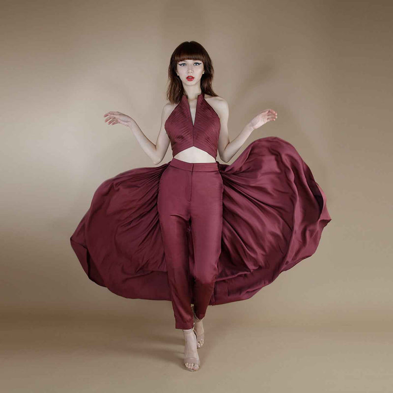 Front view of the wine solid straight-cut trousers with a voluminous pleated halter top