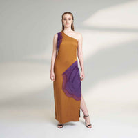 Front view of the long mustard dress with a one-shoulder purple organza panel