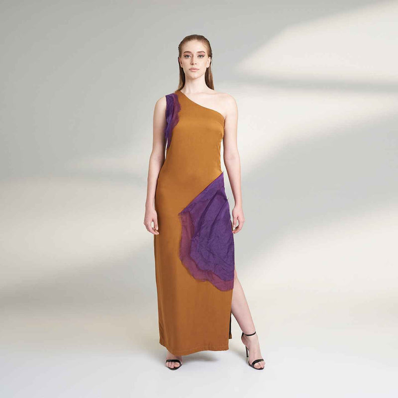 Front view of the long mustard dress with a one-shoulder purple organza panel
