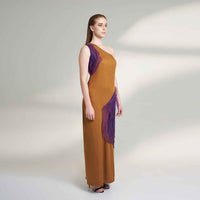 Side view of the long mustard dress showing the purple organza detail