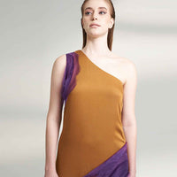 Close-up front view of the mustard dress showing the one-shoulder purple organza drape