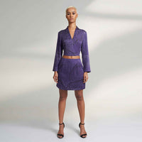 Front view of the purple tonal floral print crop top, styled with a matching mini skirt