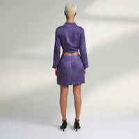 Back view of the purple tonal floral print mini skirt and crop top