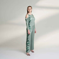 Side view of the sage green cold-shoulder jumpsuit with tonal floral print side panel