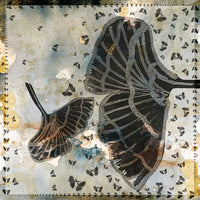 Flat detail of the butterfly print on the gold and navy scarf fabric