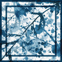 Flat detail of the blue and white splatter and branch print on the scarf fabric