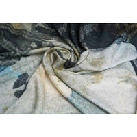 Close-up of the gold and navy butterfly print scarf fabric, gathered