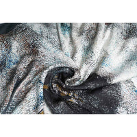 Close-up of the grey and black abstract print scarf fabric, gathered