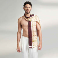 Front view of a man wearing the wine and gold branch print scarf with white trousers