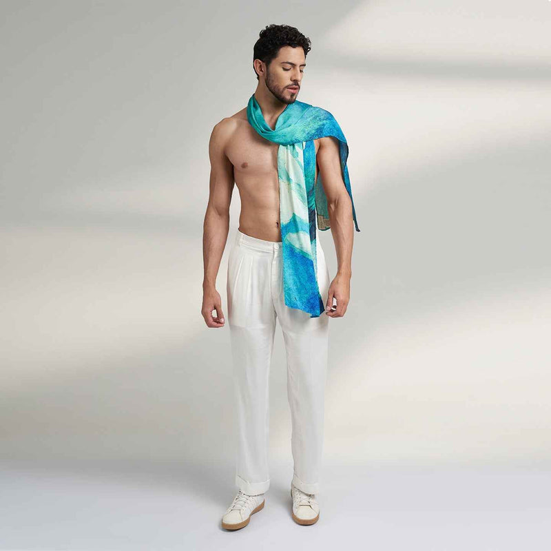 Close-up front view of a man wearing the teal watercolor print scarf