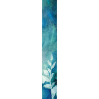 Close-up of the teal watercolor print scarf fabric with a leaf motif, folded