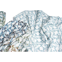 Close-up of the blue and white geometric floral print scarf fabric, gathered