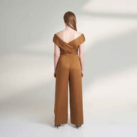 Back view of the camel brown jumpsuit with an off-shoulder draped wrap top