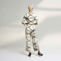 Back view of the cream and black abstract print jumpsuit