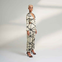 Side back view of the cream and black print jumpsuit