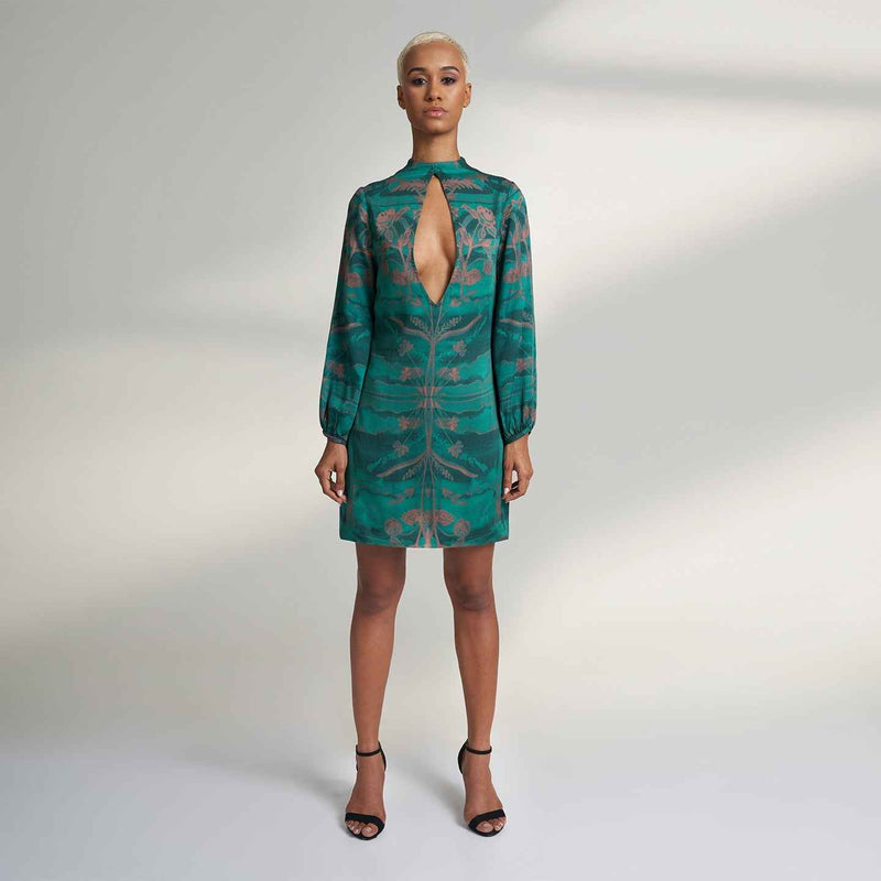 Front view of the green and peach floral print mini dress with a keyhole neckline