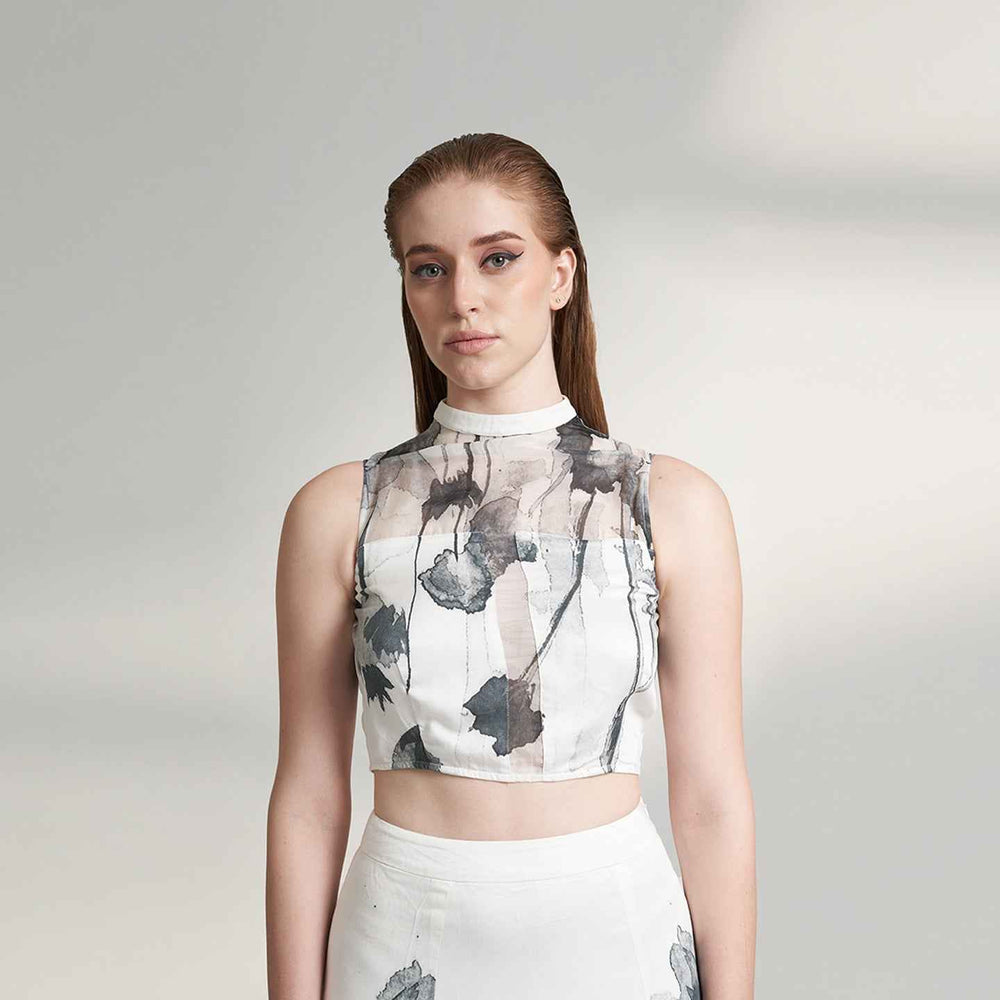 Close-up front view of the black and white floral print crop top