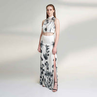 Front view of the black and white floral print crop top, styled with a matching long skirt