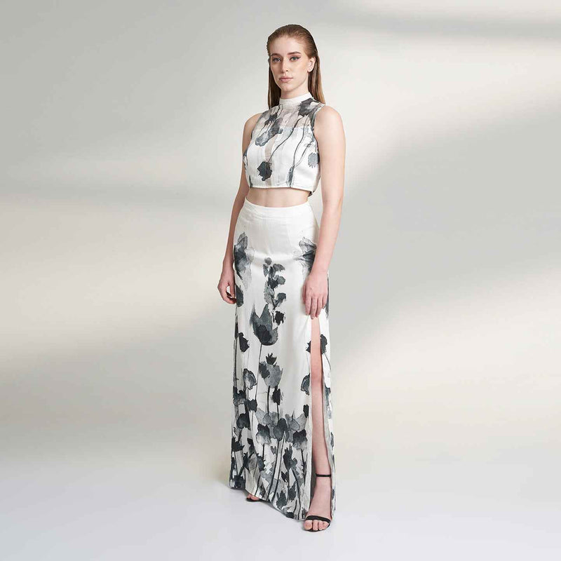 Front view of the black and white floral print crop top, styled with a matching long skirt