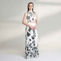 Front view of the black and white floral print crop top and skirt, full length