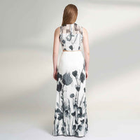 Back view of the black and white floral print crop top and matching skirt, full length