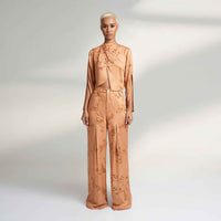 Front view of the peach branch print jacket top and wide-leg trousers