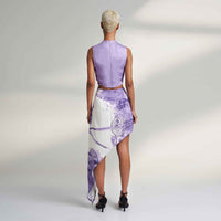 Back view of the pleated lilac purple crop top and asymmetric print skirt